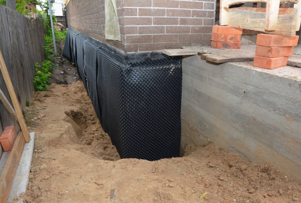 Happy homeowners after waterproofing job in New Lisbon